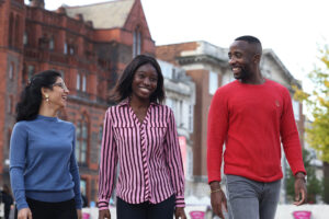 Postgraduate students walking in University Square.