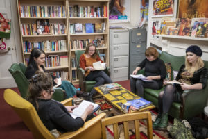 Four female students taking part in a small group tutorial in an academic office