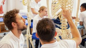 Physiotherapy students with skeleton