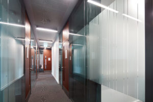 Image of corridor with lots of offices on either side.