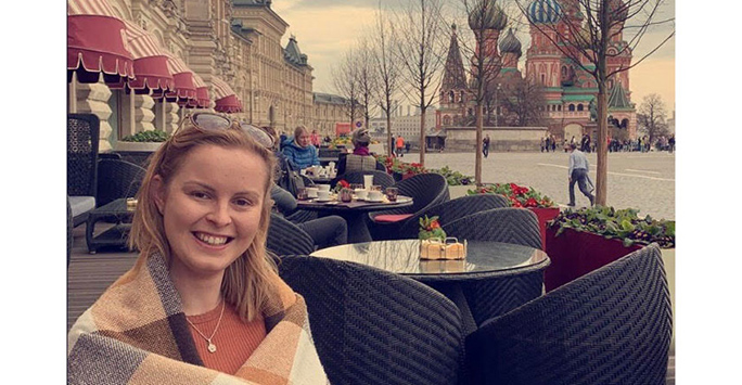 Victoria Brown sitting outdoors at a café.