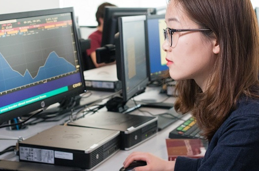 Female student uses a computer.