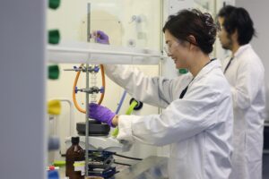 Chemistry student using equipment in a laboratory