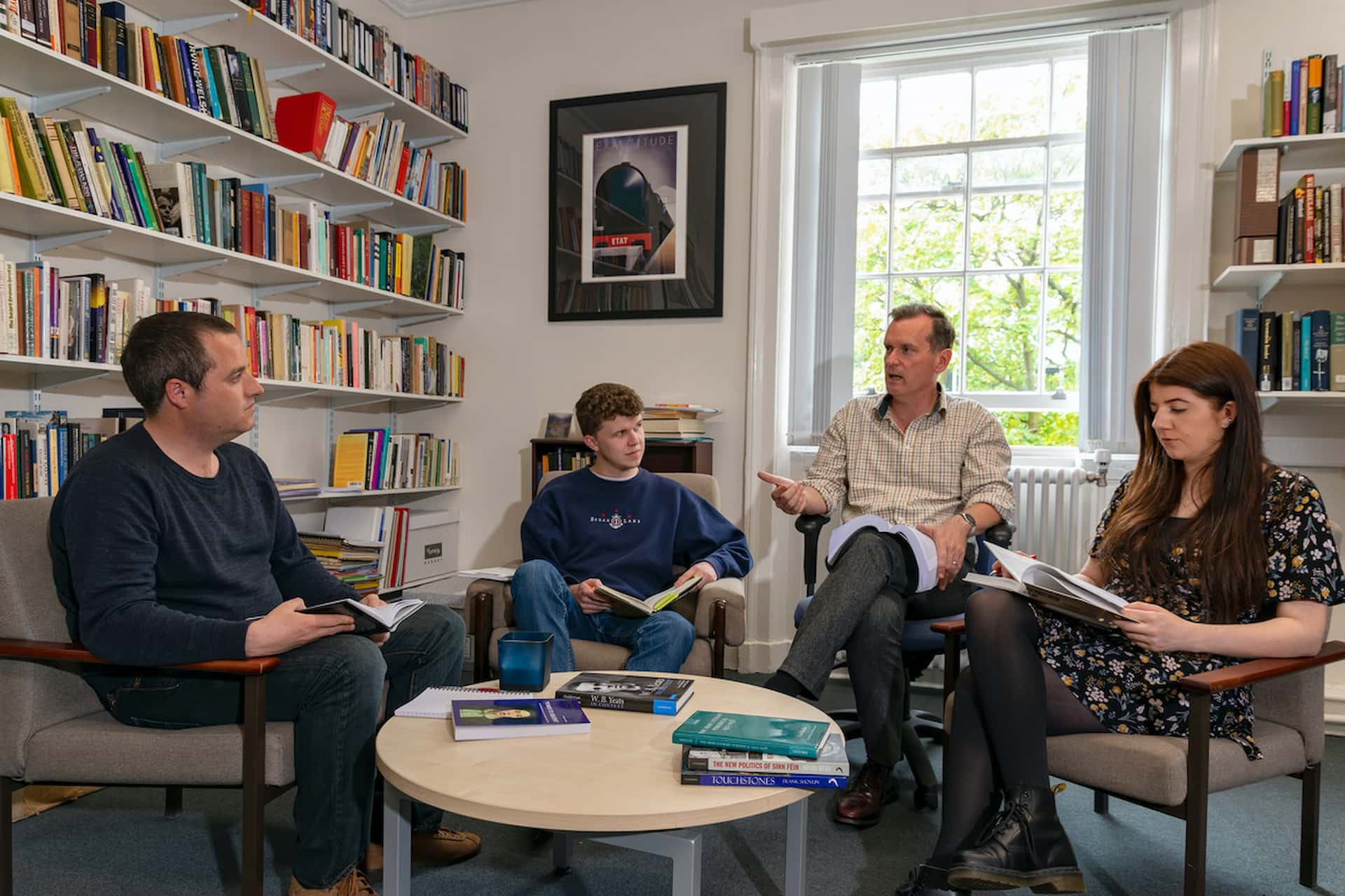 Irish Studies students in an academic office taking part in a small seminar