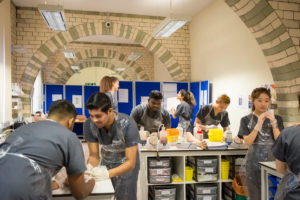 Students undertaking practical learning exercises within the School of Medicine